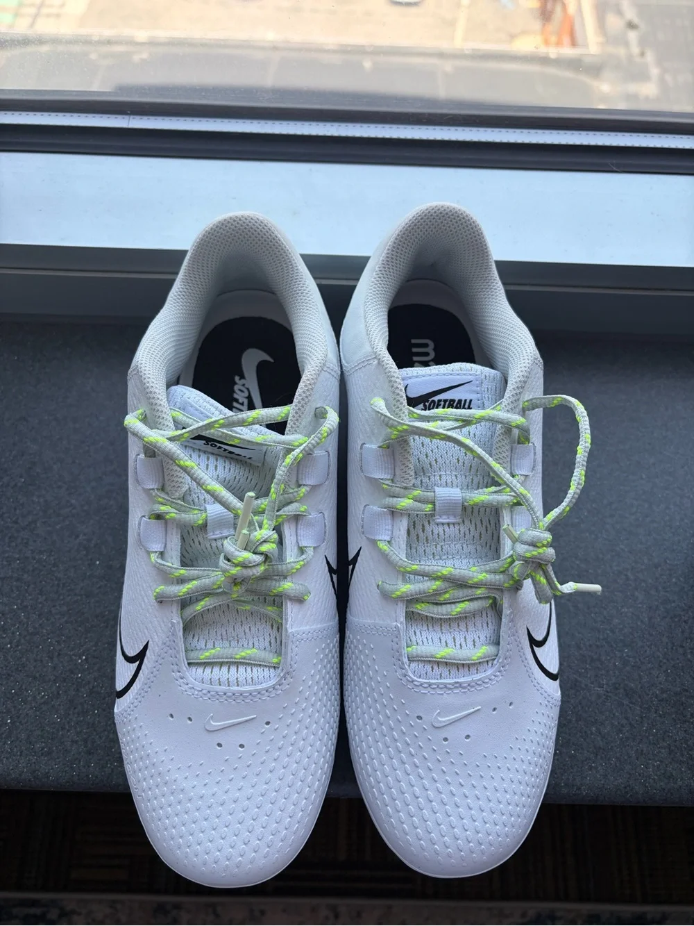 Nike Renew Softball Cleats with Black Swoosh and Neon Green Laces